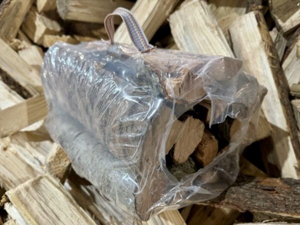 Firewood bundled in plastic wrap.