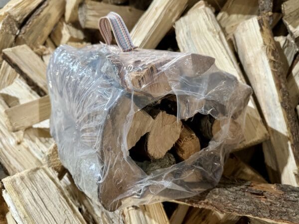 Firewood bundle wrapped in plastic.